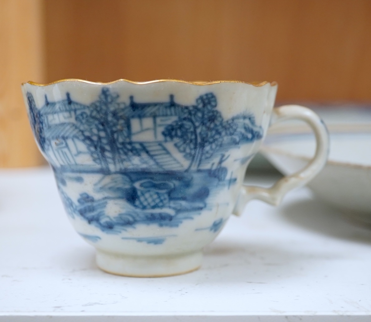 A Worcester teapot, c.1770, an 18th century Chinese famille rose and a blue and white dish, a small blue and white dish, a cup and saucer and teapot, largest dish 39cm (7). Condition - most damaged, cracked or chipped